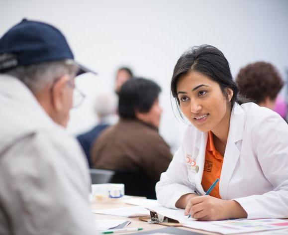 health sciences student talking with patient